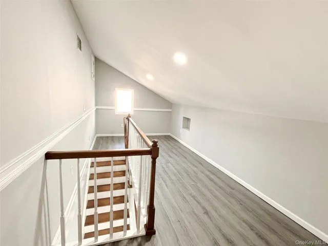 a view of entryway with wooden floor