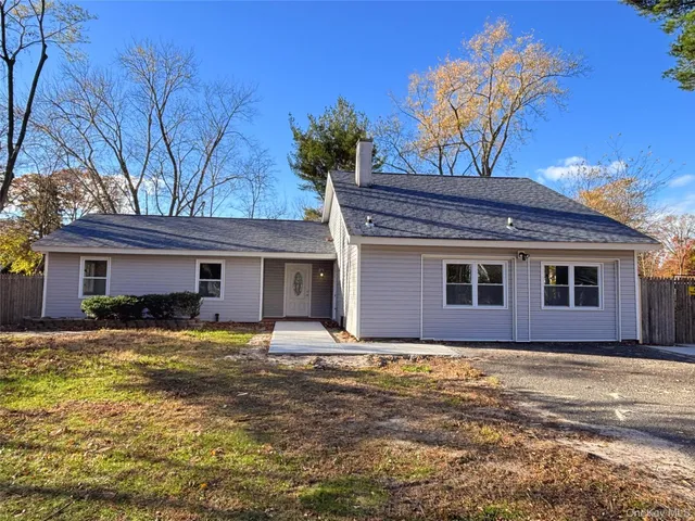 a view of a backyard of the house