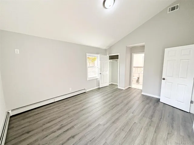 a kitchen with a refrigerator and a stove top oven