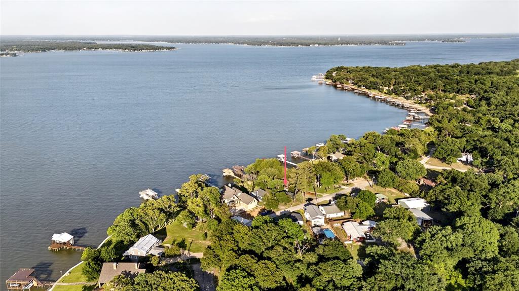 1113 Rim O The World Drive Tool, TX 75143 - Photo 39 of 40 Waterfront property featuring mature trees and a the main body of water. This residence is located in the middle of Cedar Creek Lake. Isn't that water view stunning?