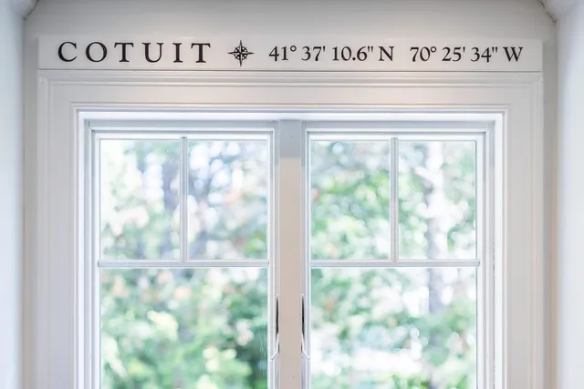 a kitchen with stainless steel appliances white cabinets and a stove top oven