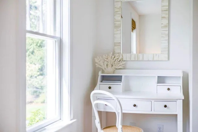 a living room with furniture and a lamp