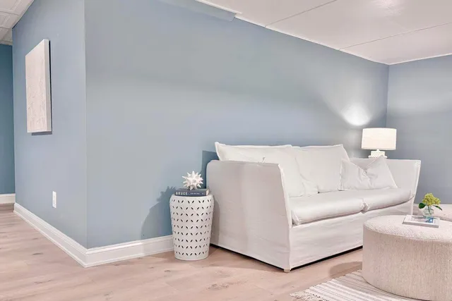 a view of a chair and table in the backyard of the house