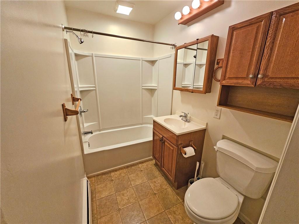 944 4th Avenue, Unit 4 Coraopolis, PA 15108 - Photo 4 of 6 a bathroom with a sink a toilet a mirror and shower