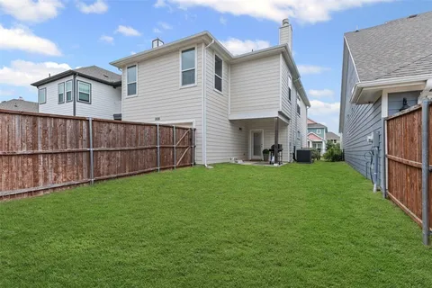 a view of a chairs in a backyard