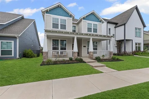 a view of a chair and tables in the balcony