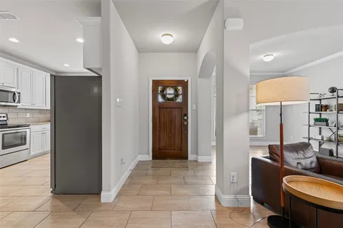 a view of an entryway with wooden floor