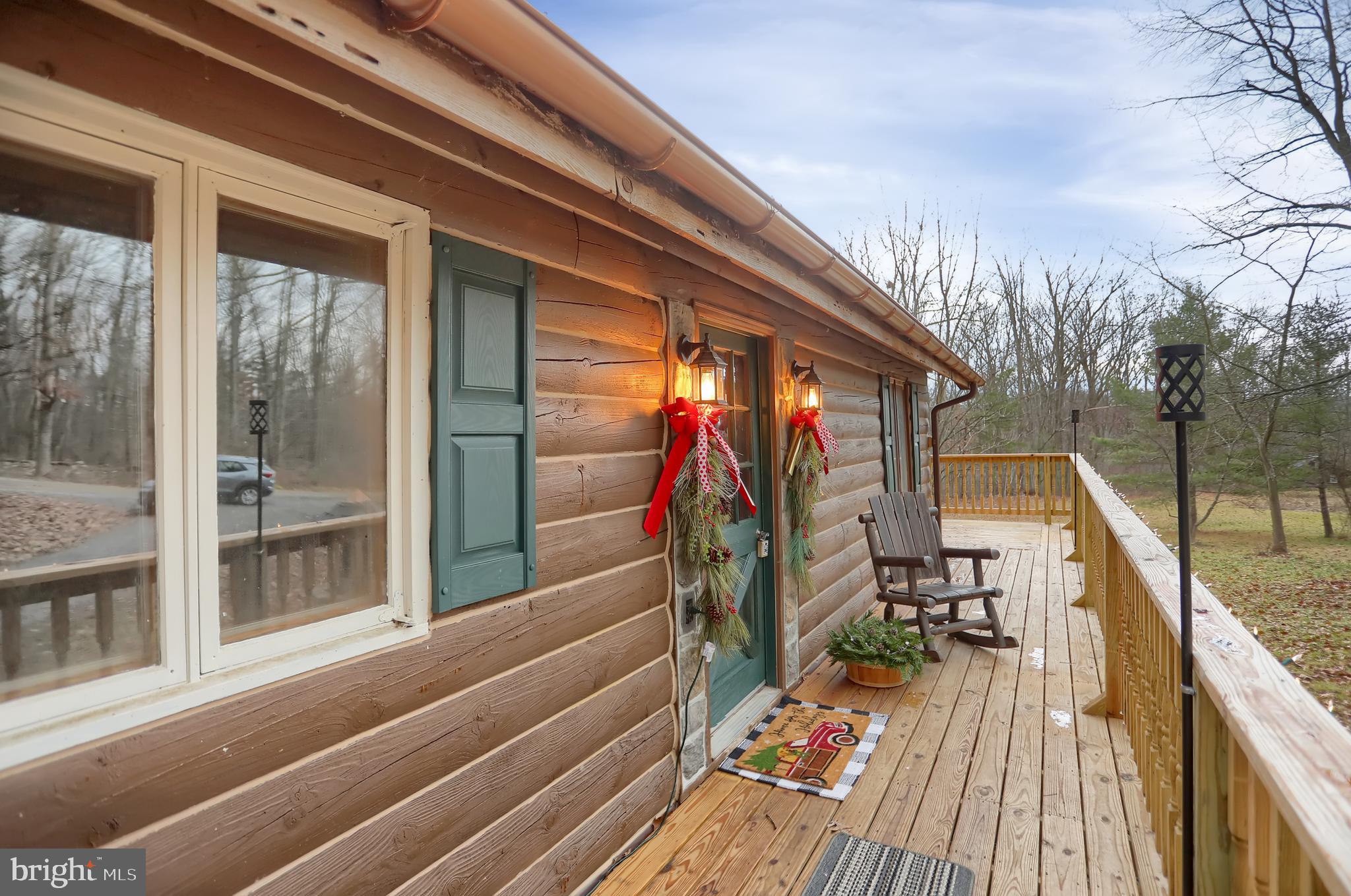 2716 Whitesel Road James Creek, PA 16657 - Photo 5 of 66 a balcony view with a wooden floor and city view