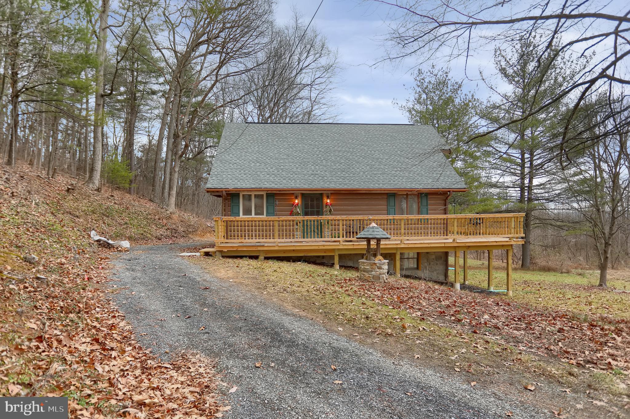 2716 Whitesel Road James Creek, PA 16657 - Photo 7 of 66 a view of a house with a yard and a large tree