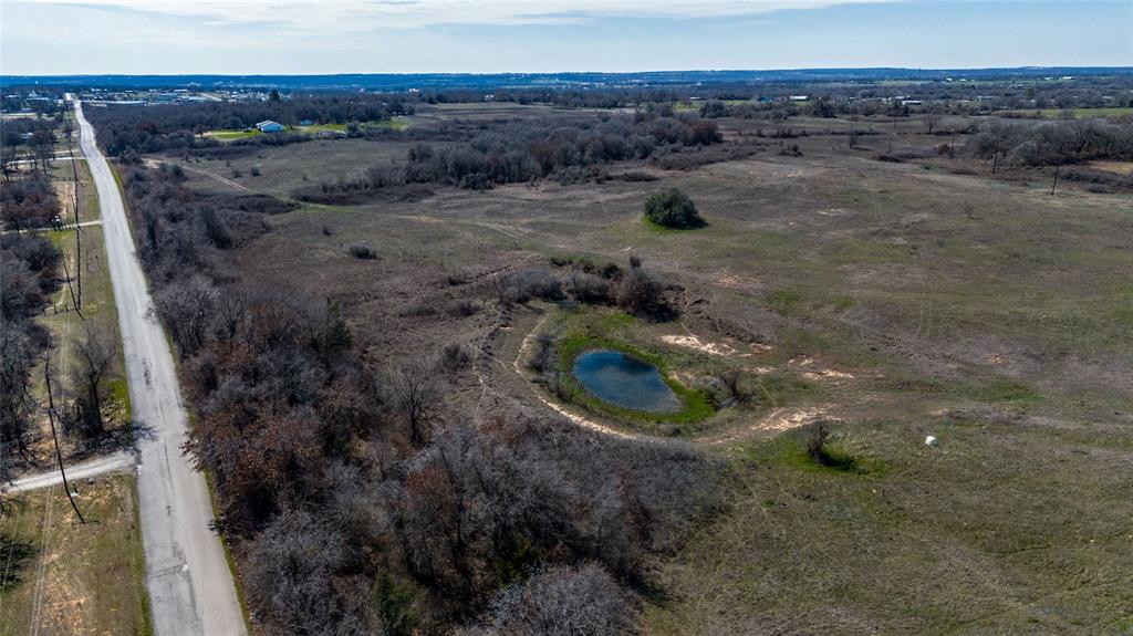 Tbd Salt Creek Road Poolville, TX 76487 - Photo 9 of 40 a view of a dry yard with wooden fence