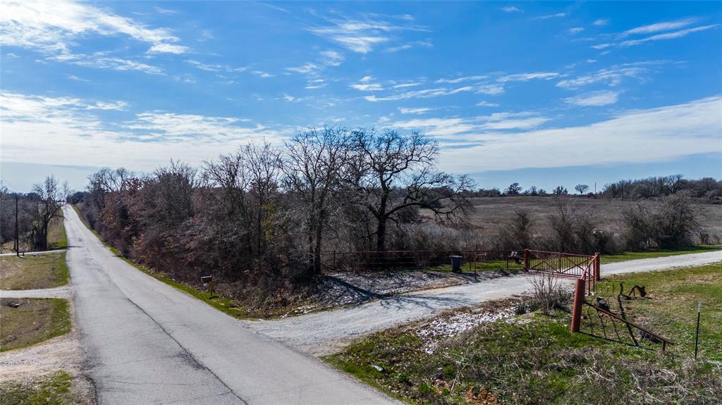Tbd Salt Creek Road Poolville, TX 76487 - Photo 10 of 40 a view of a pathway with a wrought fence