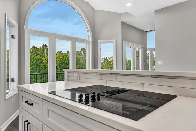 a view of balcony with wooden floor