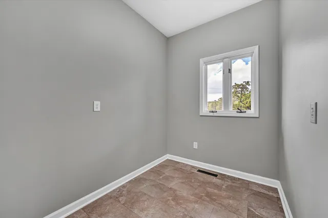 a view of a lush green hillside and a building