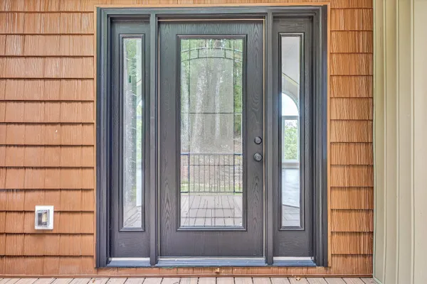 a view of an entryway with wooden floor