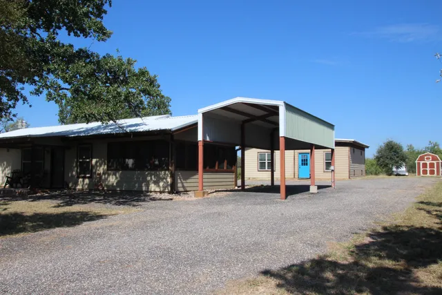 a view of a car is parked in front of a house