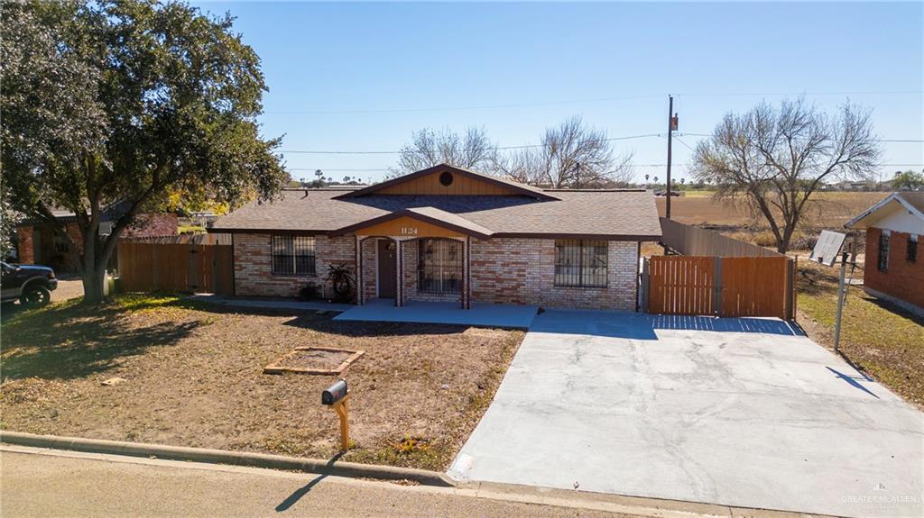 1124 Orange Street Mercedes, TX 78570 - Photo 15 of 17 a front view of a house with yard