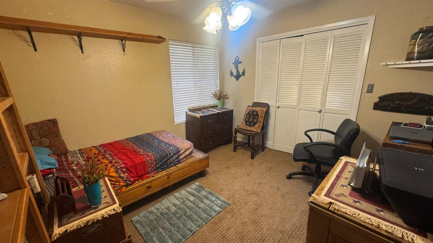 31160 Revis Road Coarsegold, CA 93614 - Photo 11 of 15 a living room with furniture rug and a window