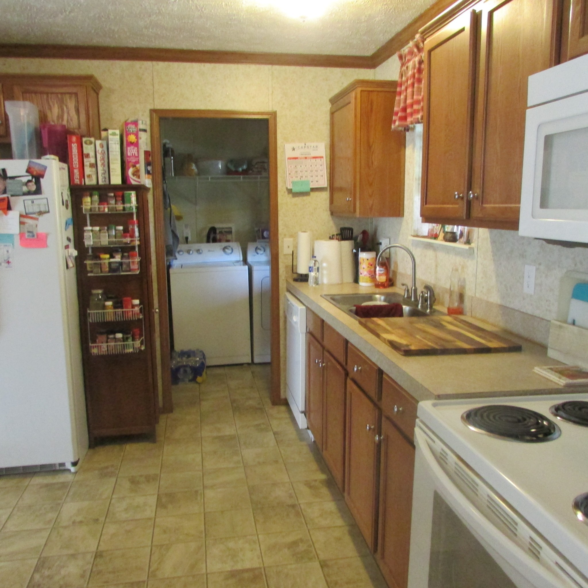 75 Snell Road Ethridge, TN 38456 - Photo 13 of 51 a kitchen that has a sink and a stove in it