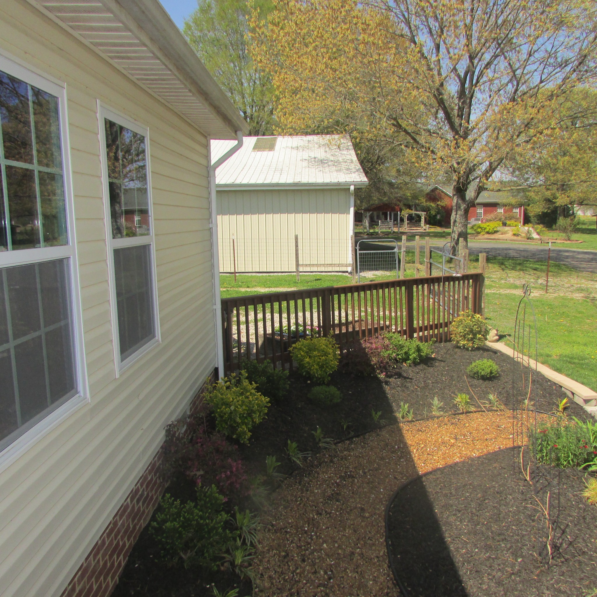 75 Snell Road Ethridge, TN 38456 - Photo 28 of 51 a view of a house with a floor to ceiling window and wooden fence