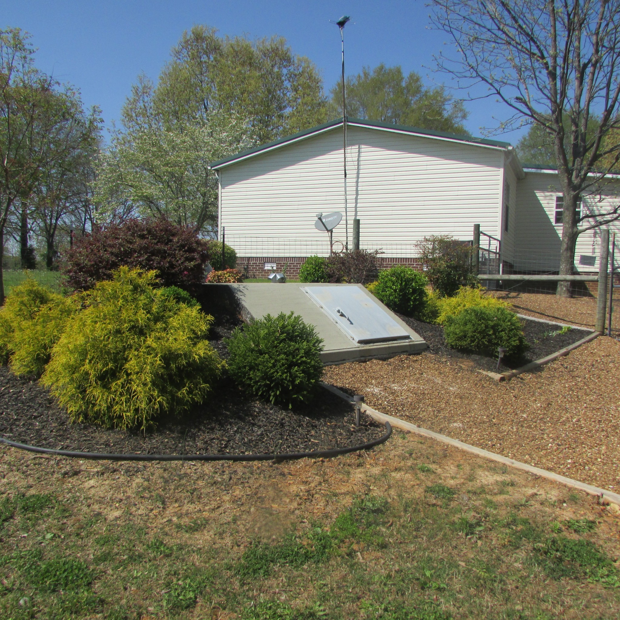 75 Snell Road Ethridge, TN 38456 - Photo 36 of 51 a house with trees in front of it