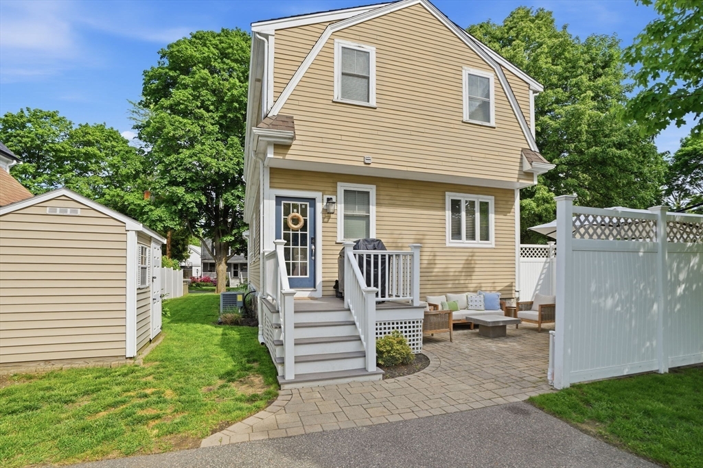 59 Elm Street Hingham, MA 02043 - Photo 30 of 33 a front view of a house with a patio