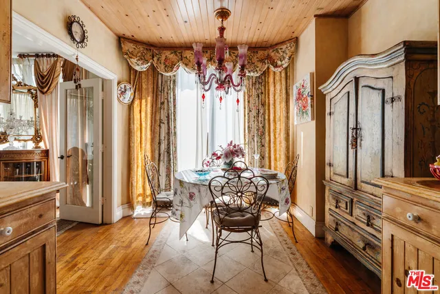 a view of a entryway with furniture and chandelier