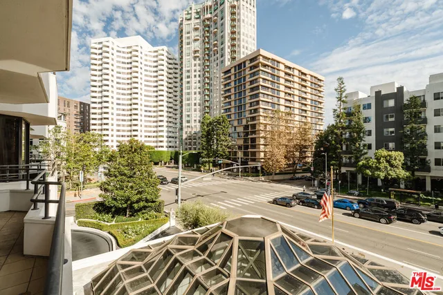 a bathroom with a glass shower door and a glass door