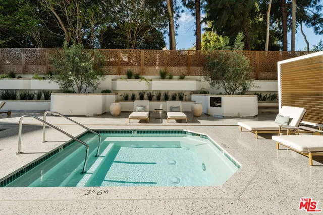 a outdoor space with patio the couches and a fireplace