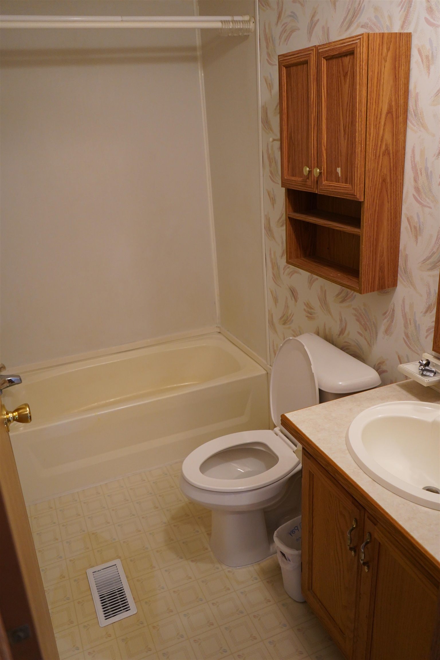 47 Coban Drive Duluth, MN 55808 - Photo 18 of 23 Full bathroom featuring wallpapered walls, vanity, and bathing tub / shower combination