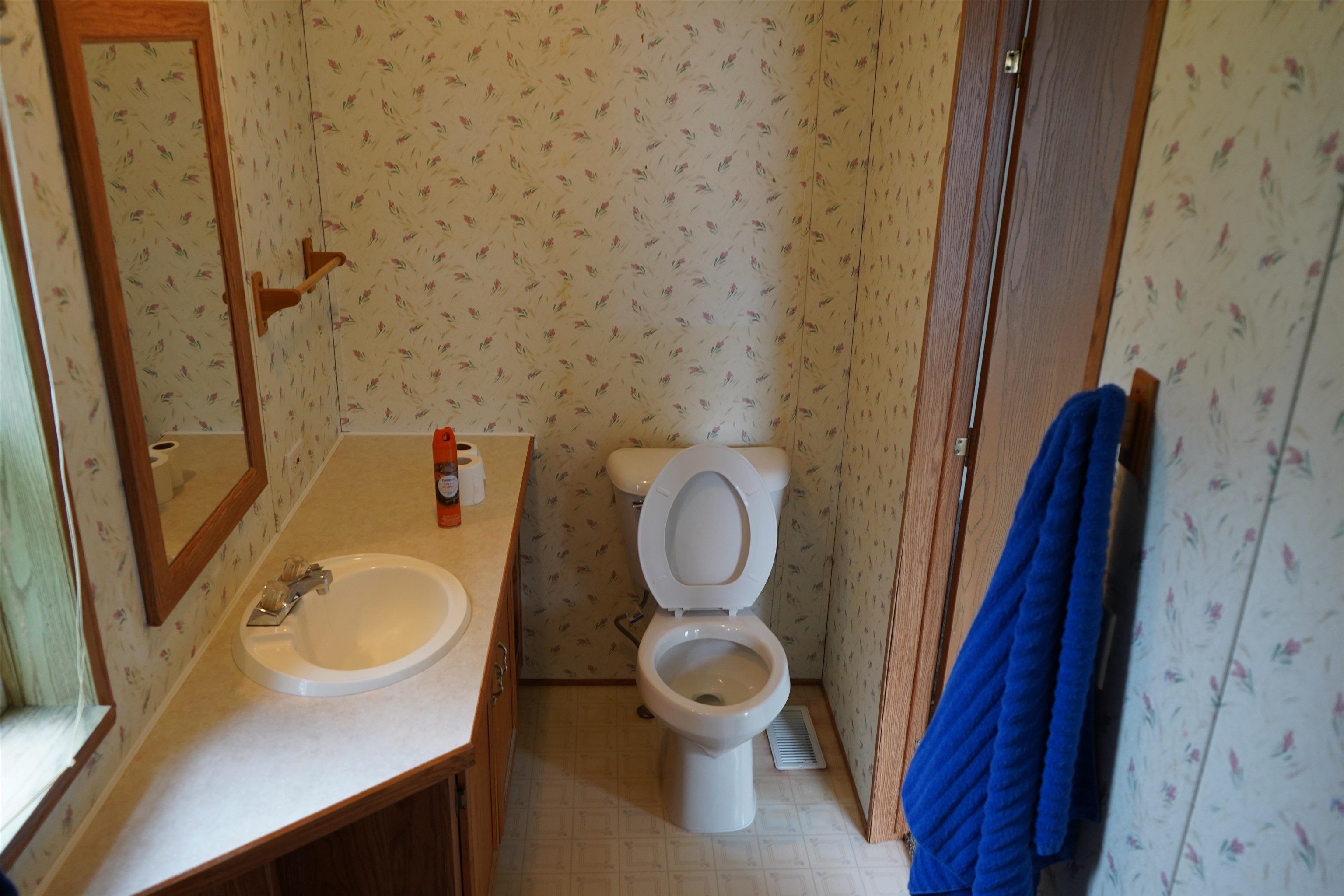 47 Coban Drive Duluth, MN 55808 - Photo 20 of 23 Bathroom with wallpapered walls, vanity, and tile patterned floors