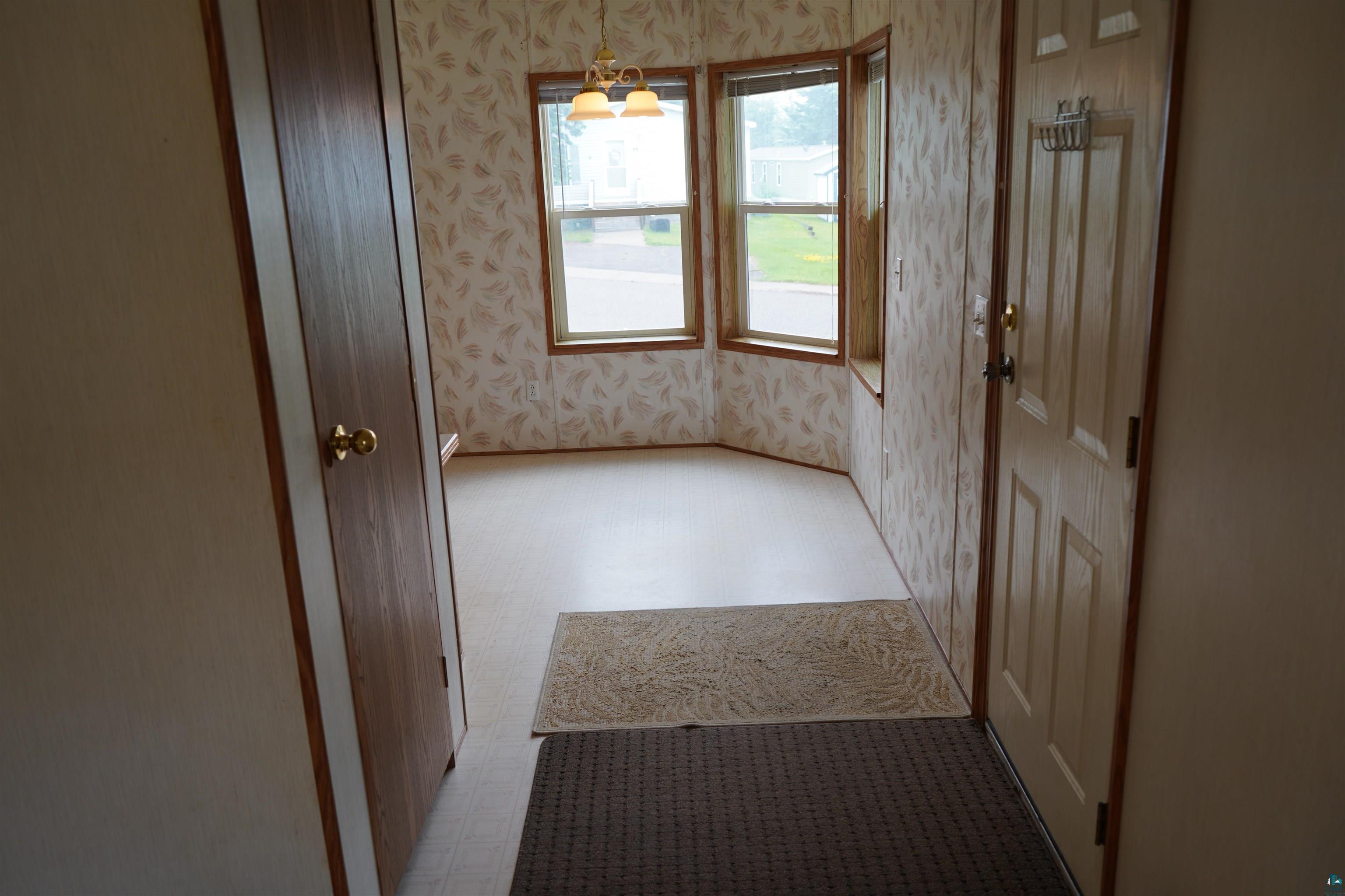 47 Coban Drive Duluth, MN 55808 - Photo 9 of 23 Interior space featuring wallpapered walls and tile patterned floors