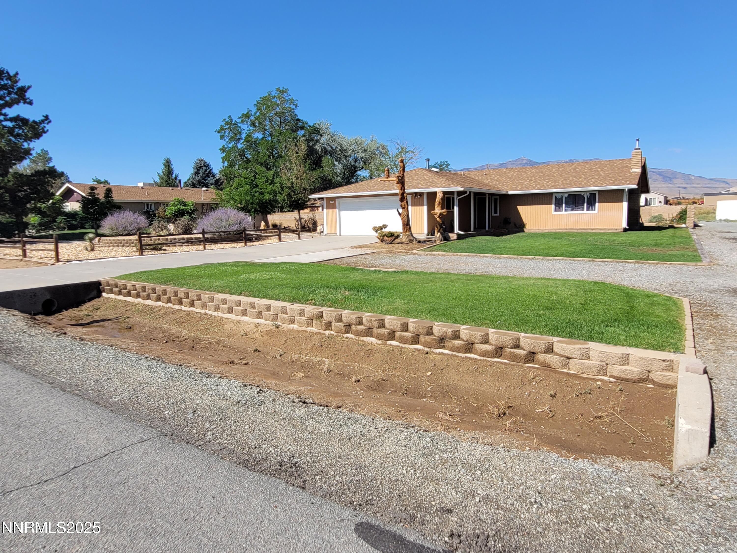 7215 Marlin Drive Reno, NV 89506 - Photo 1 of 40 a front view of house with yard and green space