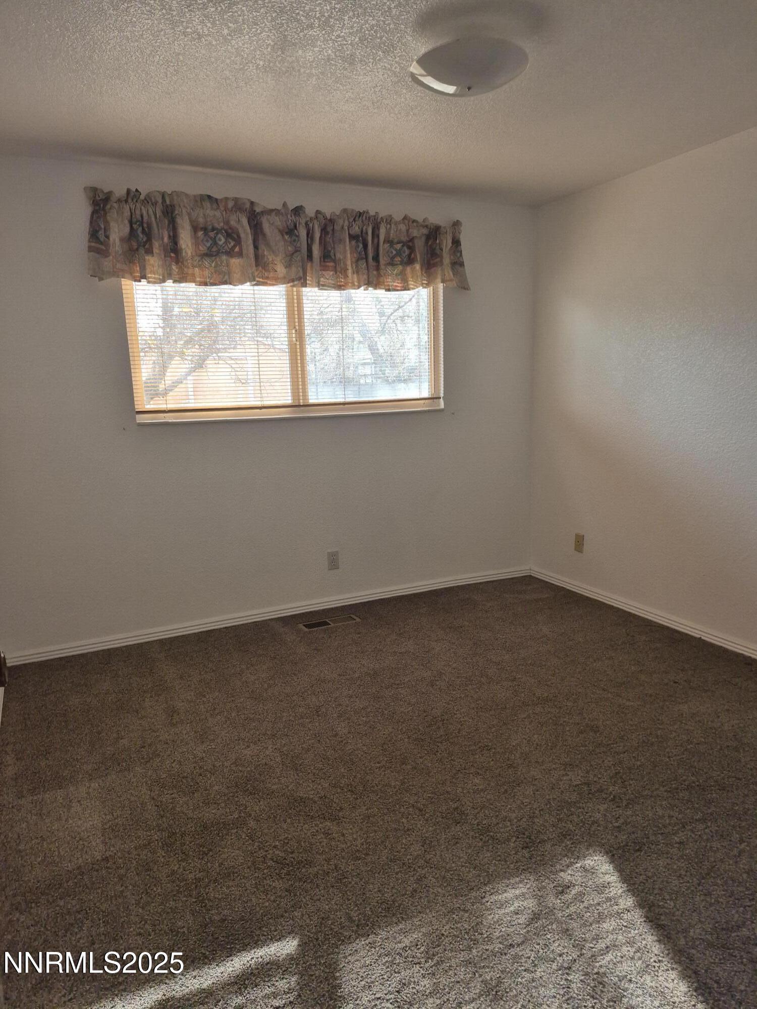 7215 Marlin Drive Reno, NV 89506 - Photo 11 of 40 an empty room with a window