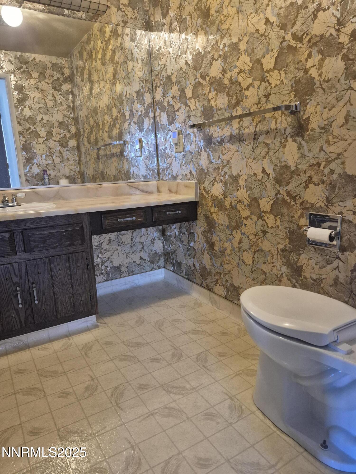 7215 Marlin Drive Reno, NV 89506 - Photo 13 of 40 a bathroom with a toilet and a sink
