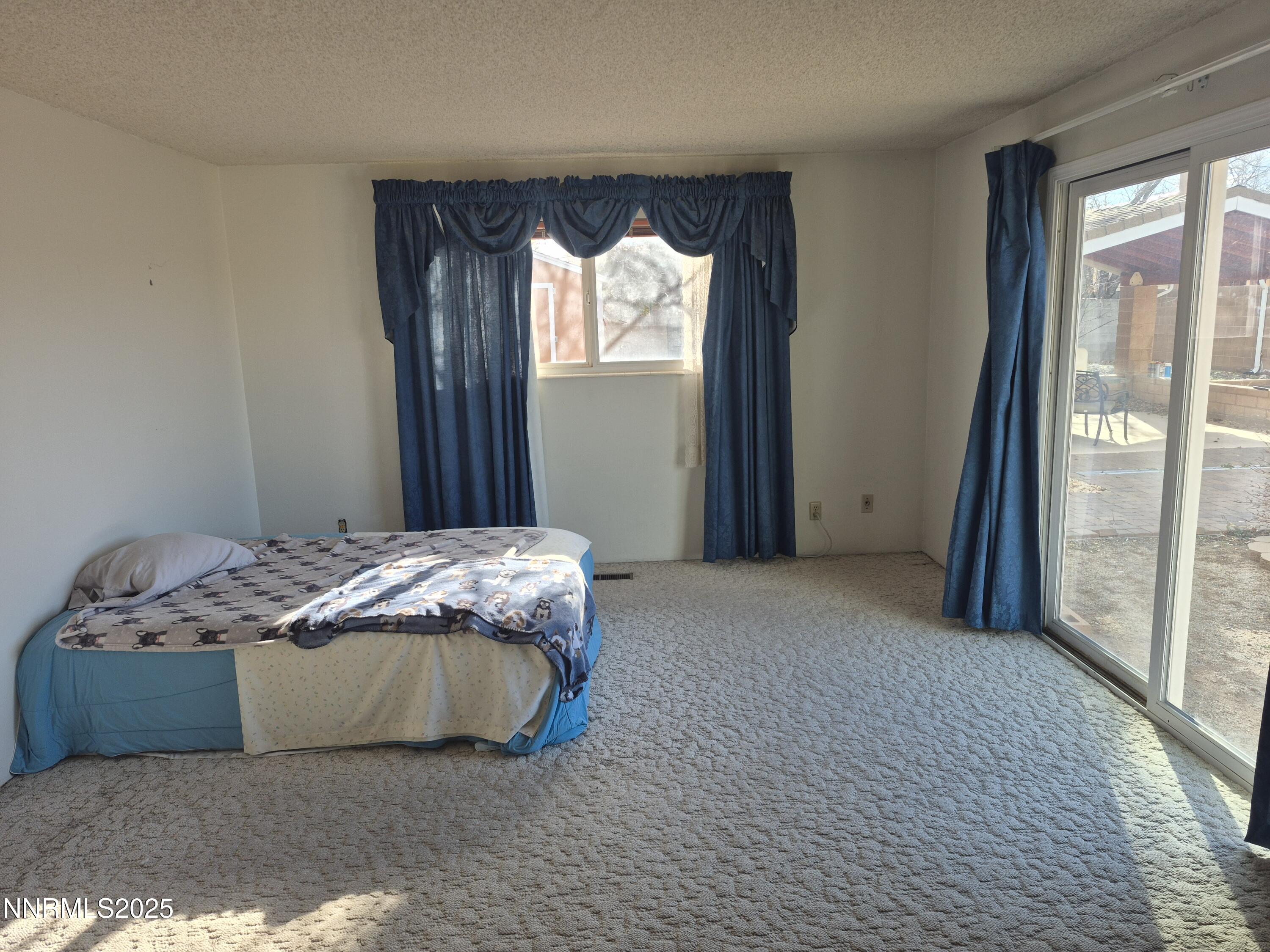 7215 Marlin Drive Reno, NV 89506 - Photo 14 of 40 a bedroom with a bed and window
