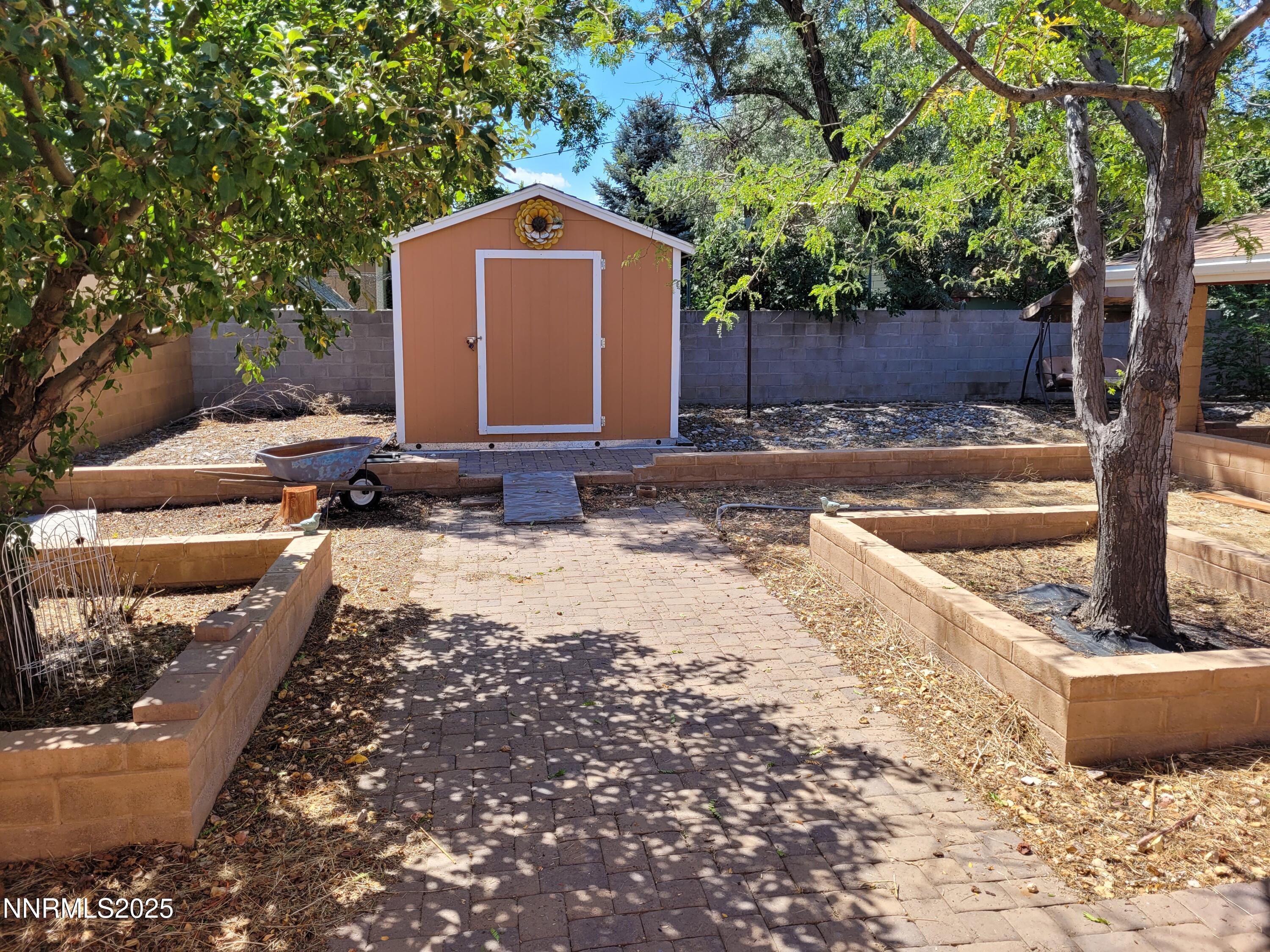 7215 Marlin Drive Reno, NV 89506 - Photo 27 of 40 a front view of a house with a yard