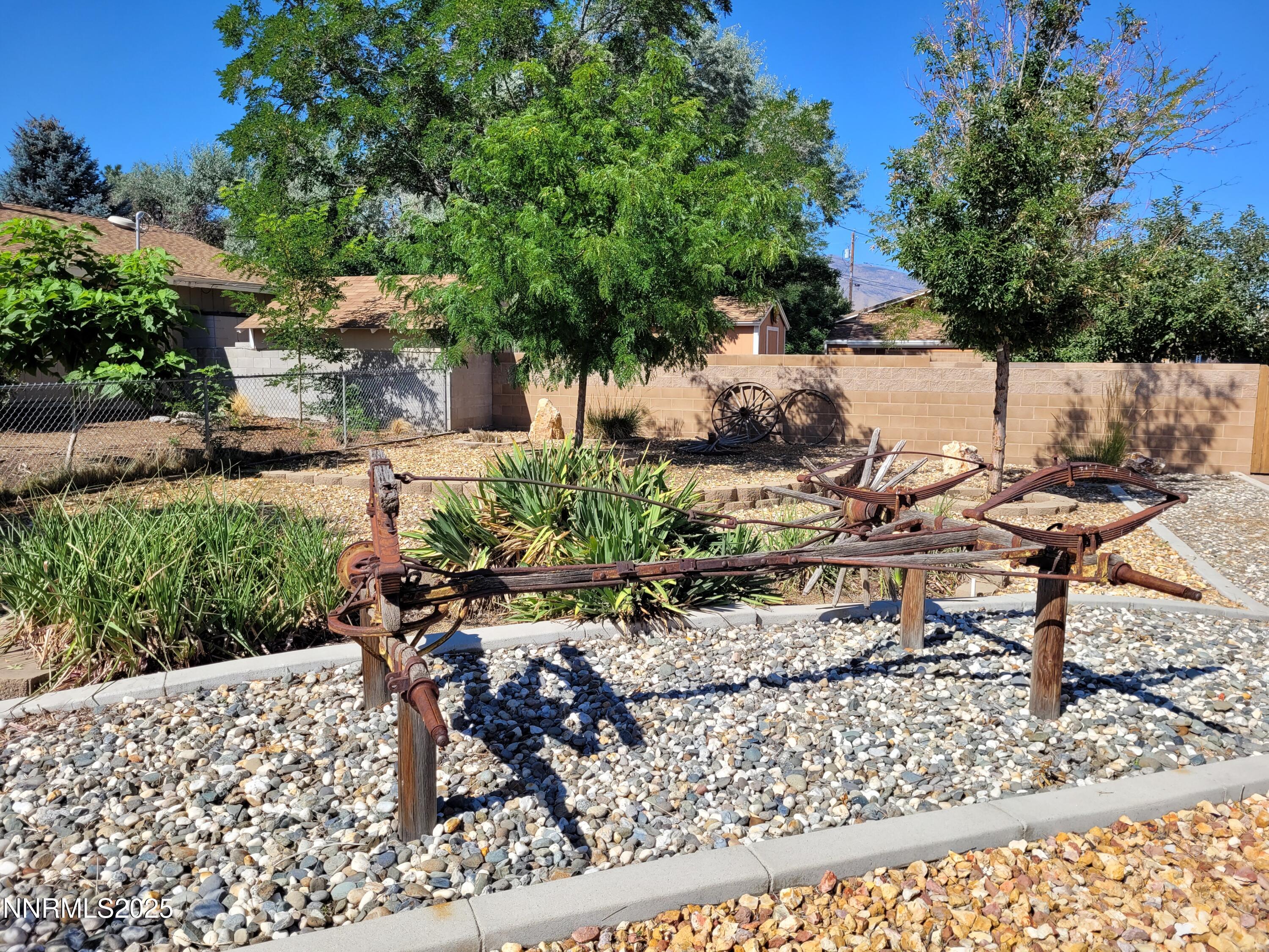 7215 Marlin Drive Reno, NV 89506 - Photo 3 of 40 a view of a backyard with plants and sitting area