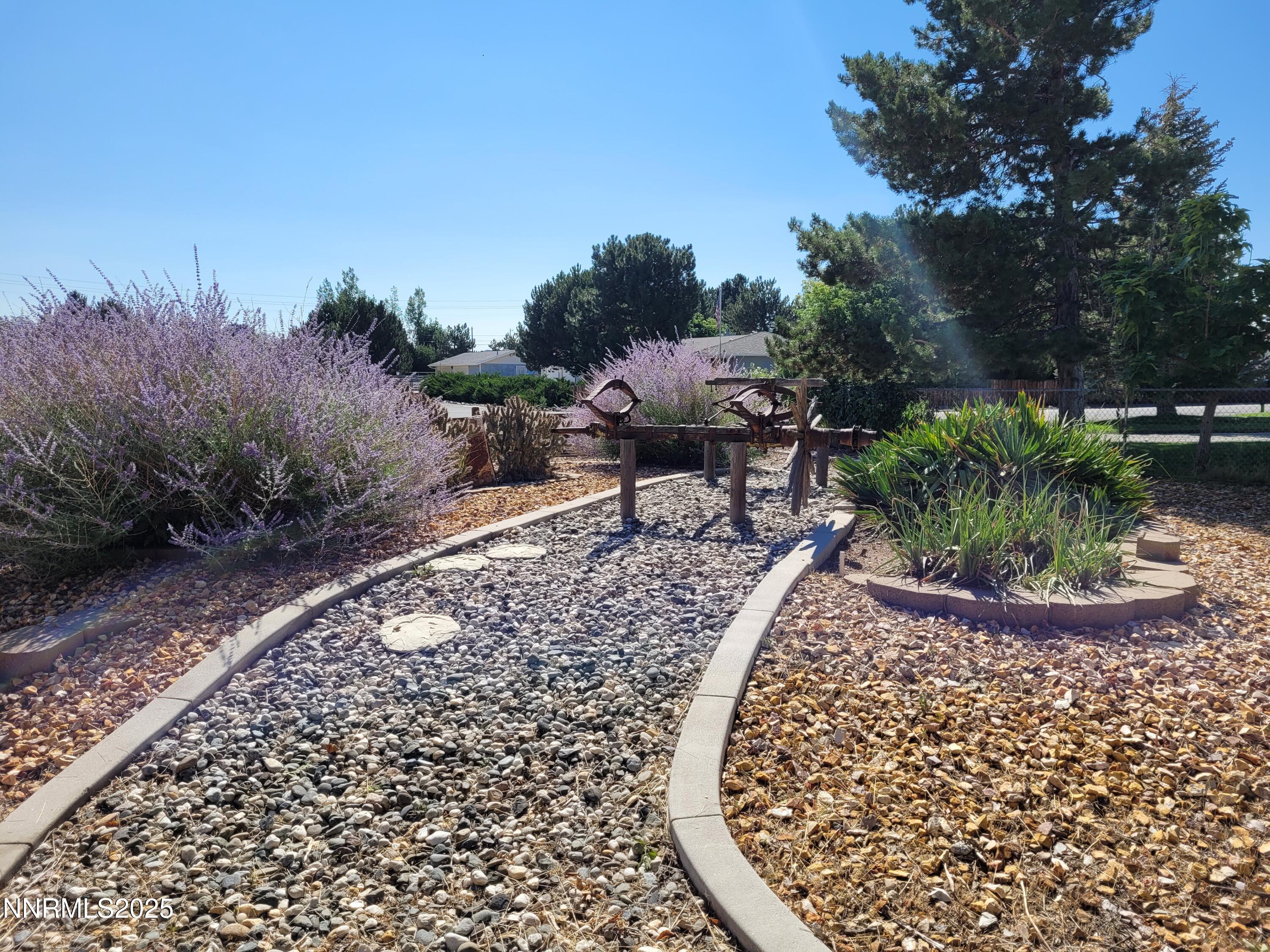 7215 Marlin Drive Reno, NV 89506 - Photo 4 of 40 a view of a backyard with plants and outdoor seating