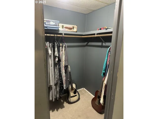 a view of a closet with storage