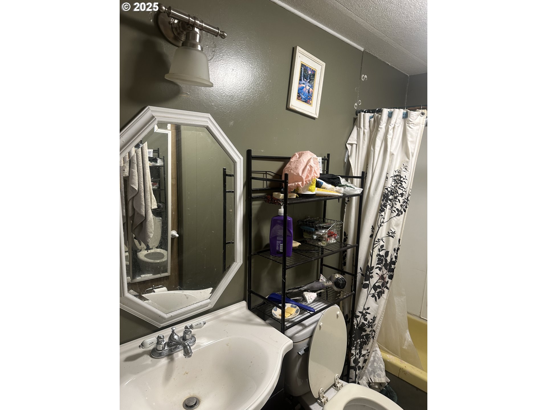 47775 Berry Street, Unit D6 Oakridge, OR 97463 - Photo 15 of 18 a bathroom with a sink toilet and mirror