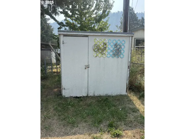 a view of door with wooden wall