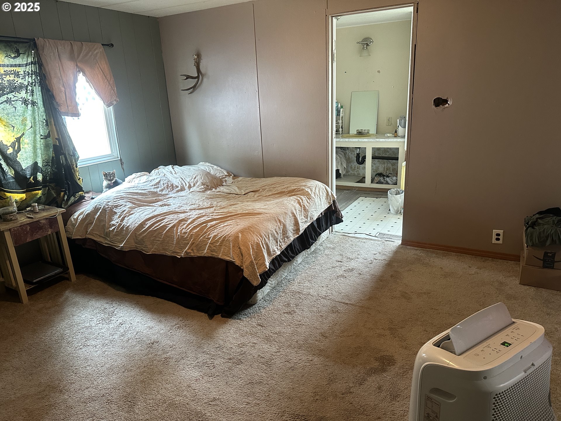 47775 Berry Street, Unit D6 Oakridge, OR 97463 - Photo 9 of 18 a bedroom with a bed and a table