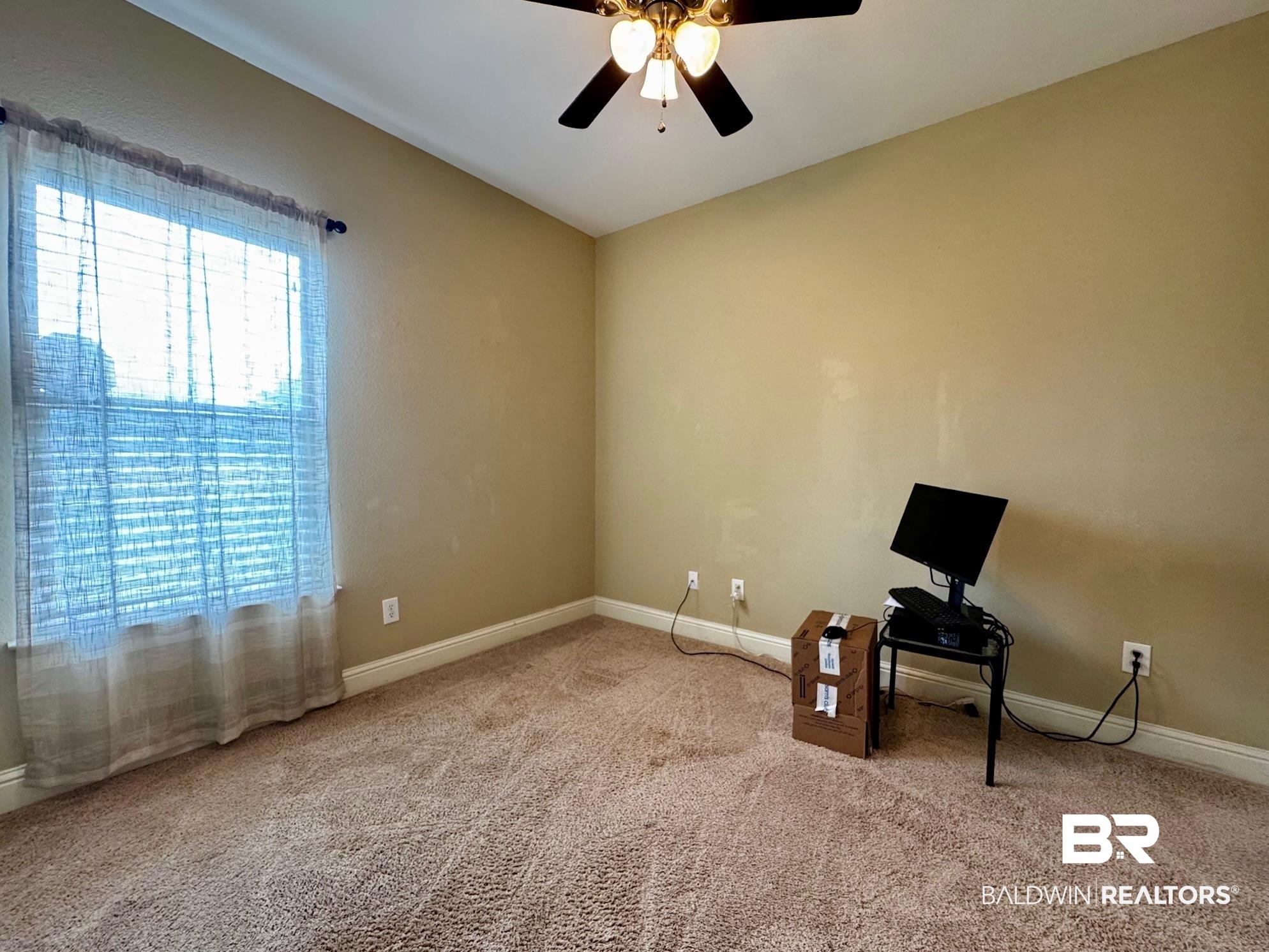 1030 Crown Walk Drive Foley, AL 36535 - Photo 25 of 40 Misc room featuring carpet, baseboards, and ceiling fan
