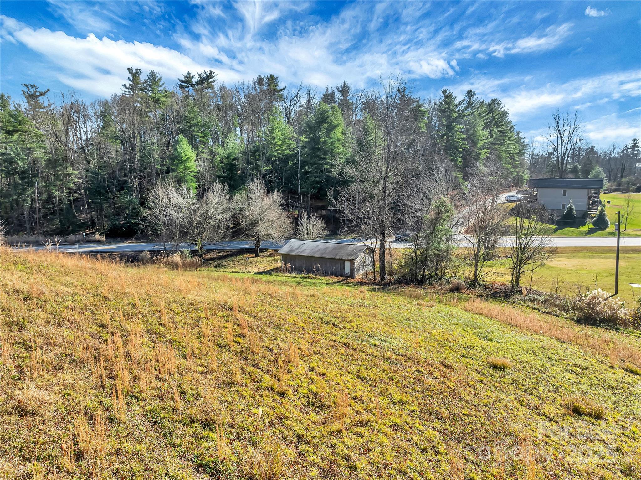 a swimming pool with outdoor seating and yard