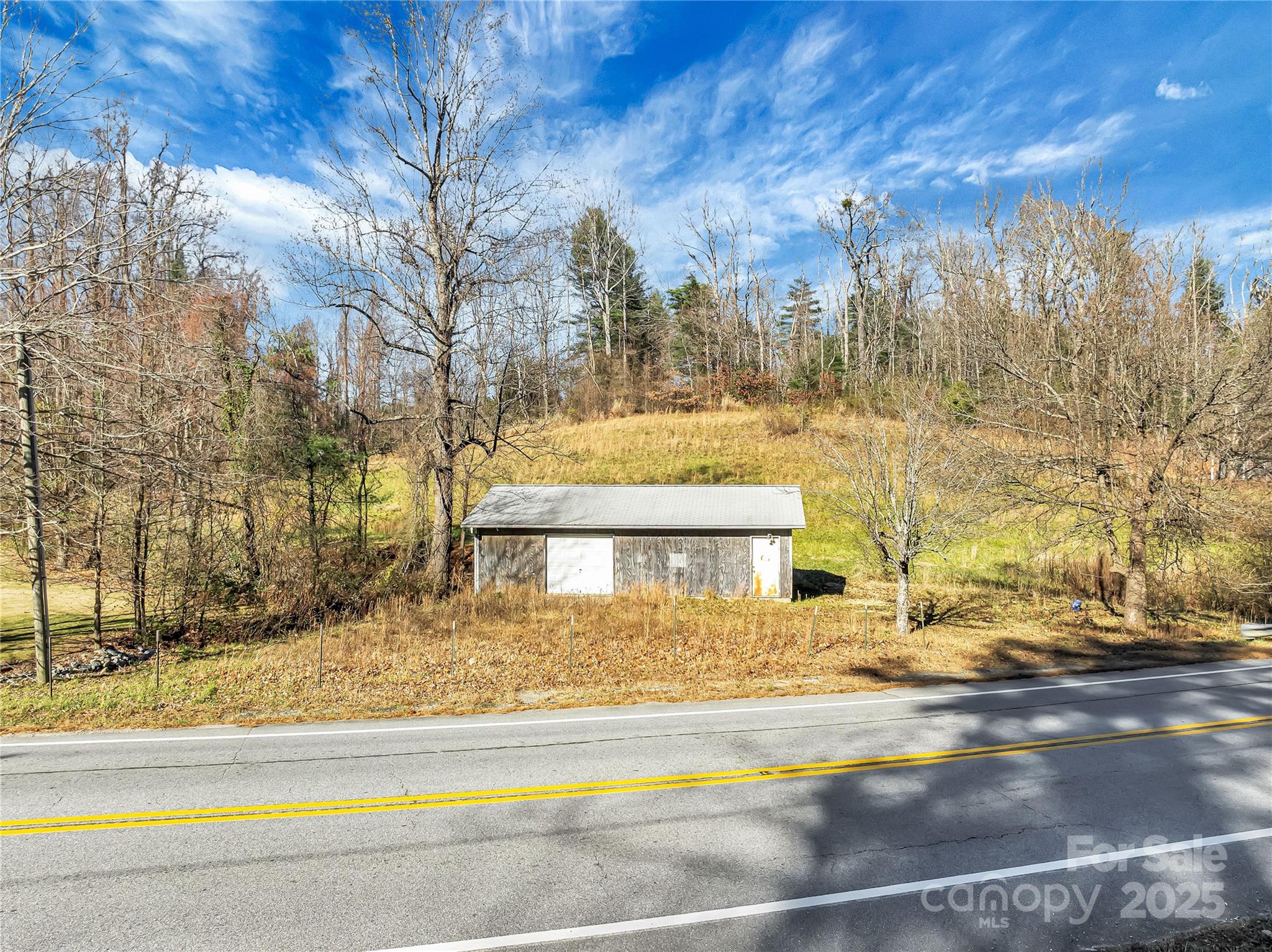 283 Ozone Drive Saluda, NC 28773 - Photo 2 of 16 a front view of a house with a yard