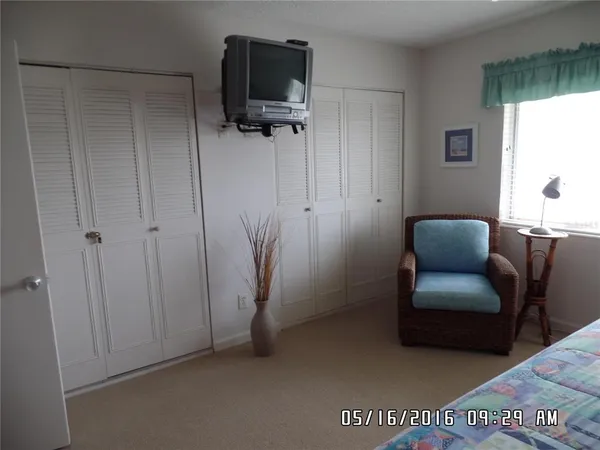 a view of workspace with furniture and a window
