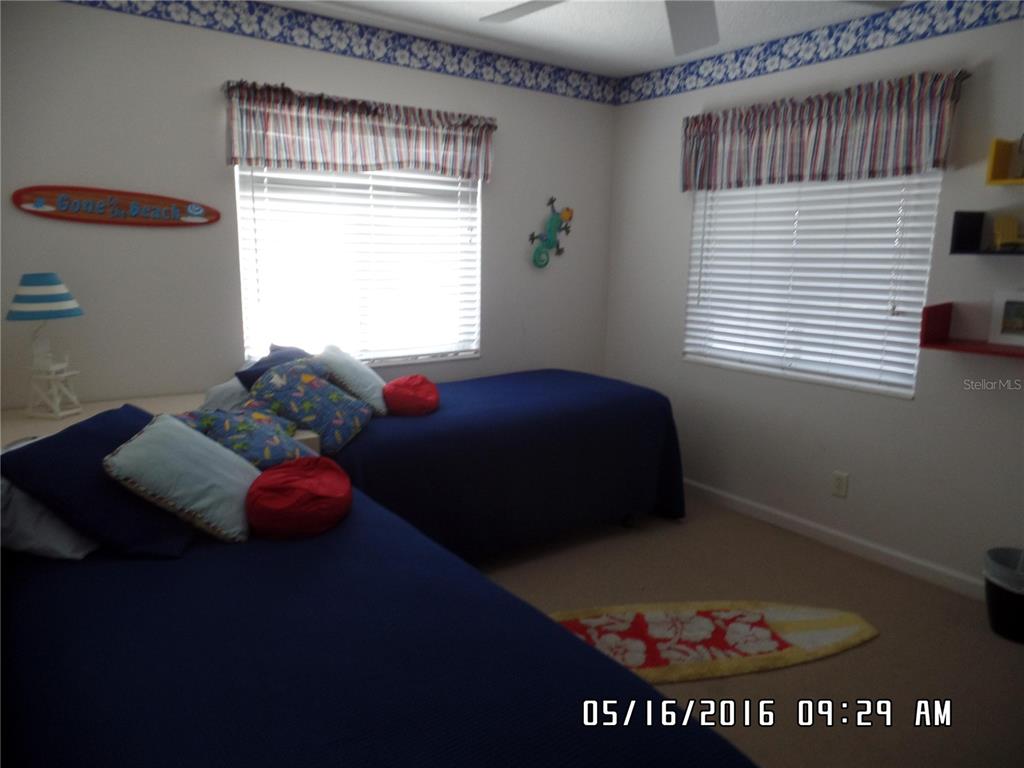 815 Ocean Shore Boulevard, Unit 9A Ormond Beach, FL 32176 - Photo 9 of 9 a bedroom with a bed and a window