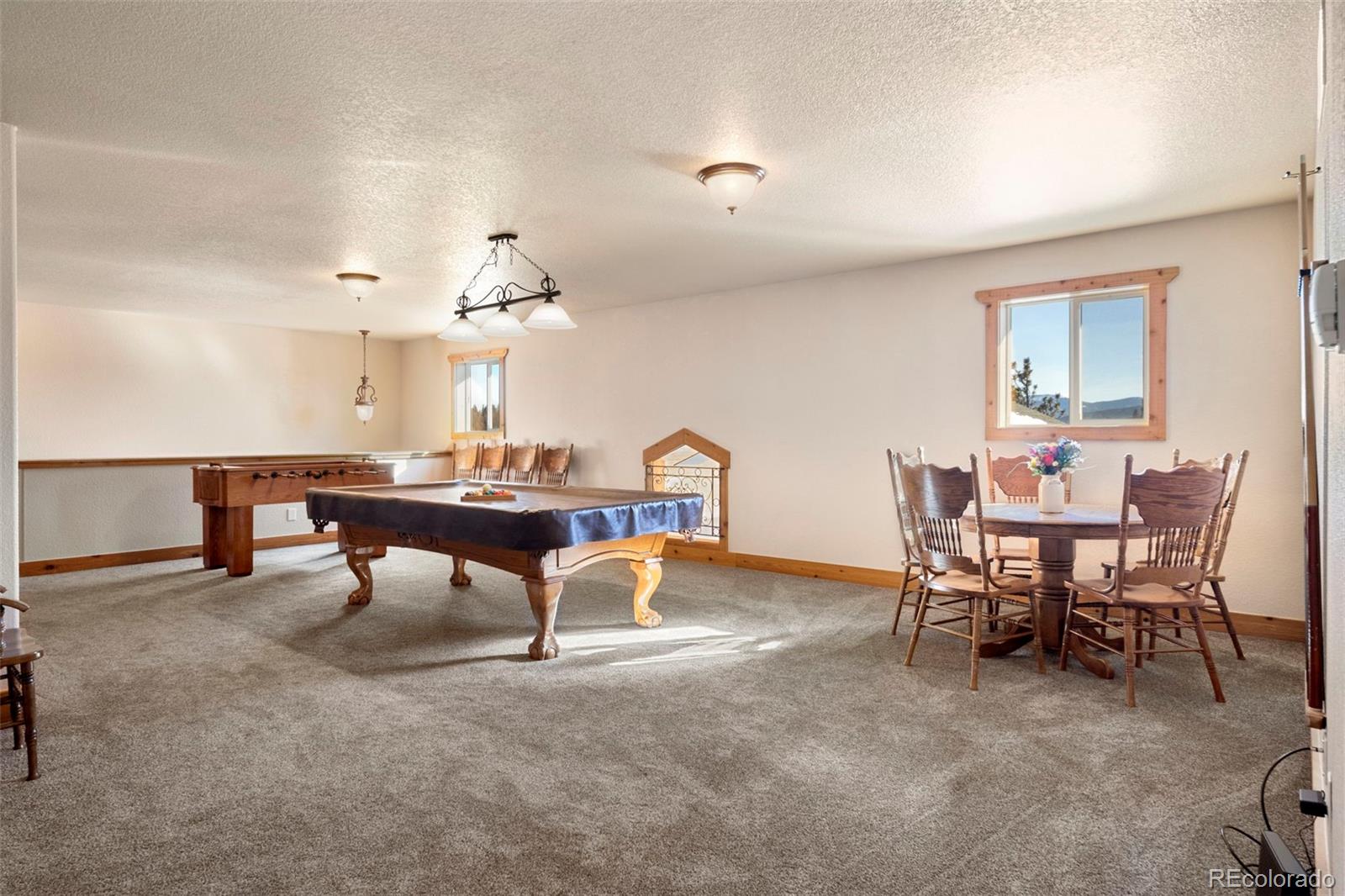 412 Evergreen Road Black Hawk, CO 80422 - Photo 43 of 48 a view of a dining room with furniture and a chandelier