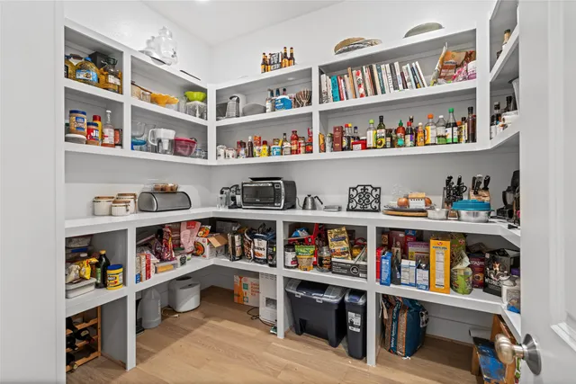 a room with furniture a book shelf and a book shelf