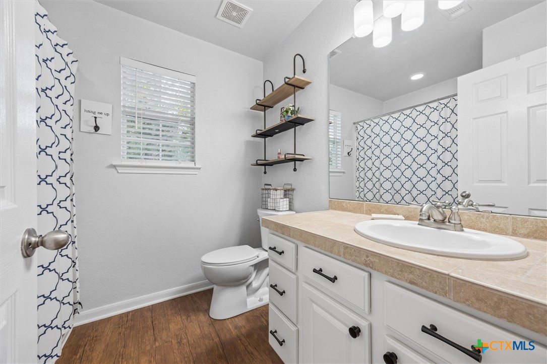 1328 Cottonwood Road Fischer, TX 78623 - Photo 24 of 35 a bathroom with a sink toilet and shower